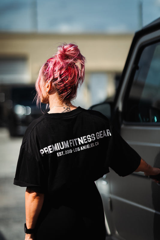 woman wearing uppper t-shirt getting in car