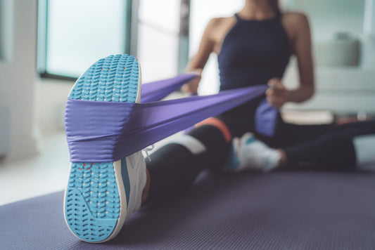 woman stretching with resistance band